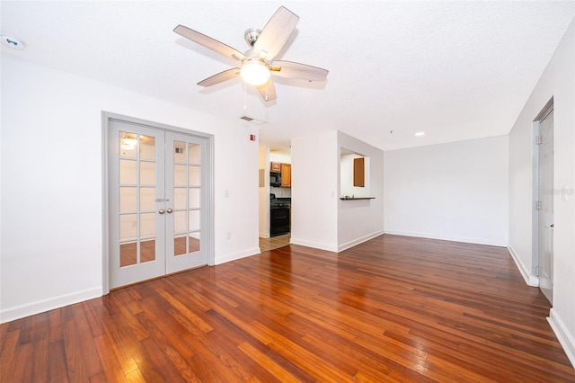 unfurnished living room featuring ceiling fan, dark hardwood / wood-style flooring, a textured ceiling, and french doors