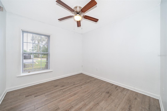 empty room featuring ceiling fan and wood-type flooring