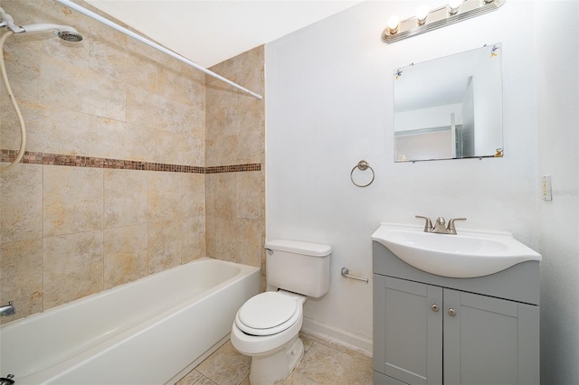 full bathroom featuring vanity, tiled shower / bath combo, and toilet