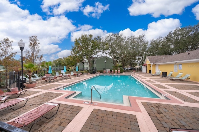 view of swimming pool with a patio area