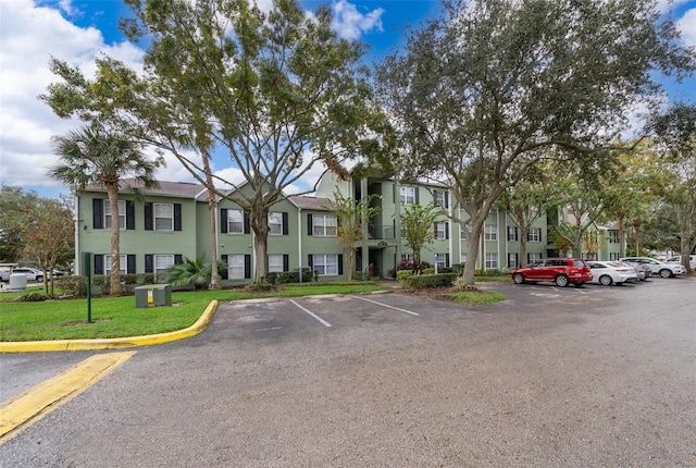 view of car parking featuring a yard