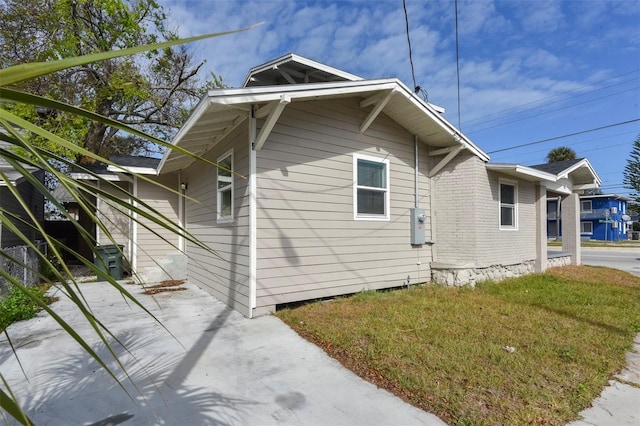 view of home's exterior featuring a lawn