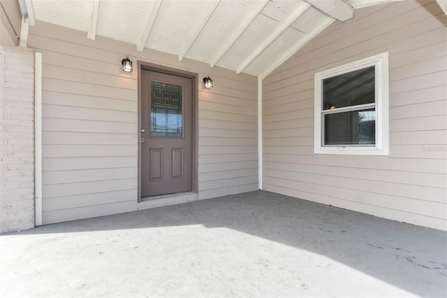 entrance to property with brick siding