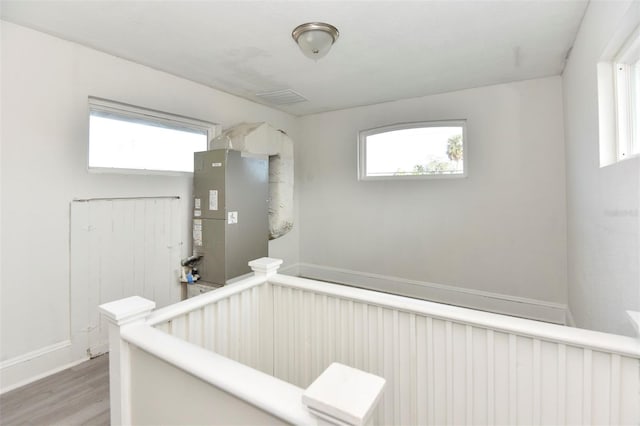 interior space featuring a healthy amount of sunlight and wood finished floors