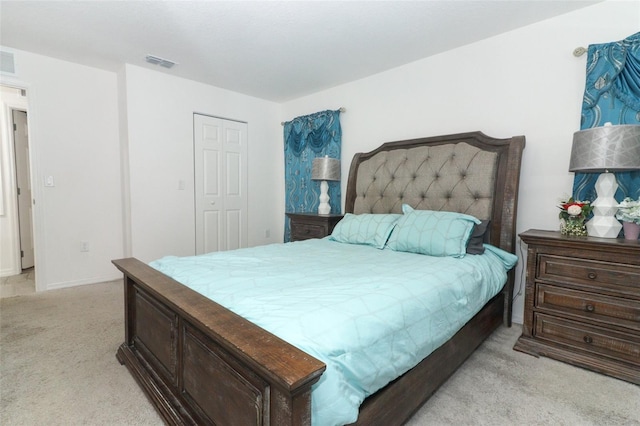 carpeted bedroom with a closet