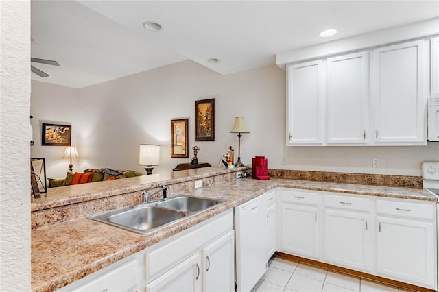 kitchen featuring kitchen peninsula, white appliances, white cabinetry, and sink