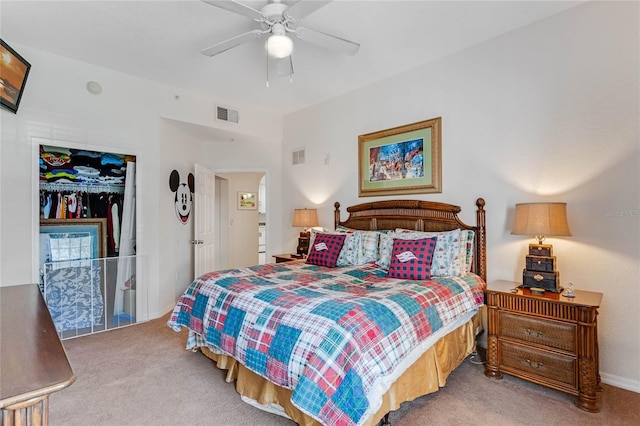 bedroom featuring carpet, ceiling fan, and a closet