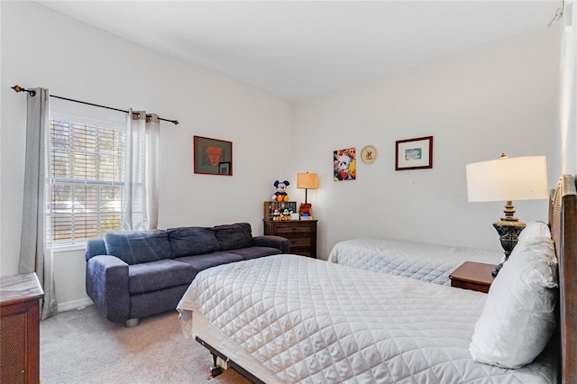 bedroom with light colored carpet