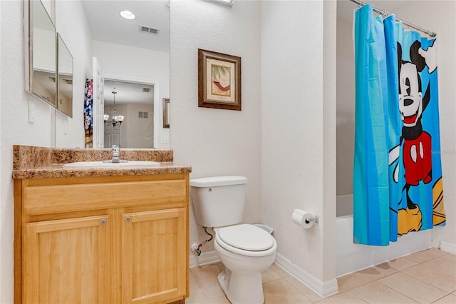 full bathroom featuring tile patterned flooring, shower / bath combination with curtain, vanity, and toilet