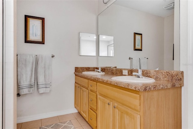 bathroom featuring tile patterned flooring and vanity