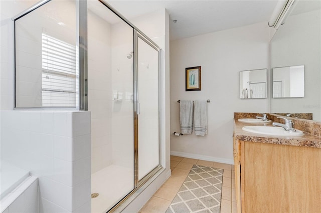 bathroom with vanity, tile patterned floors, and walk in shower