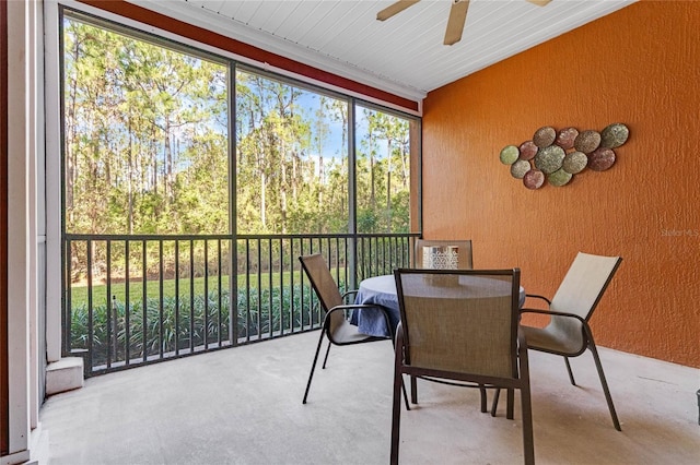 sunroom / solarium with ceiling fan