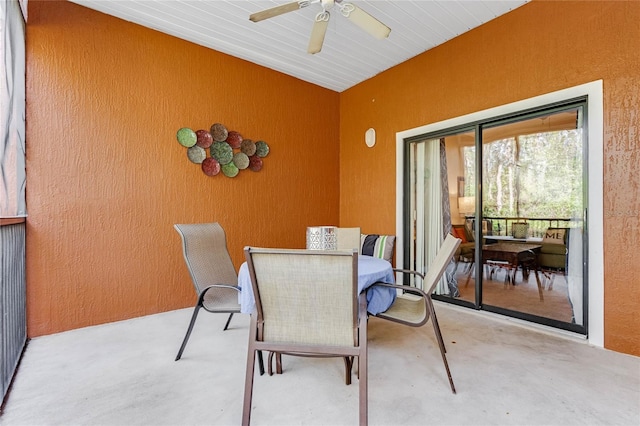 dining room featuring concrete floors and ceiling fan