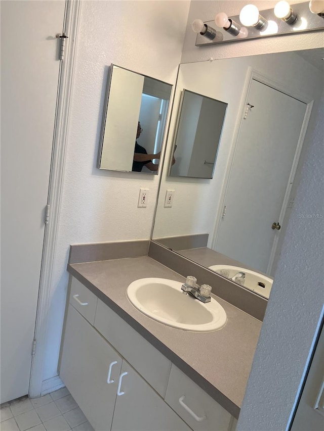 bathroom featuring vanity and tile patterned floors