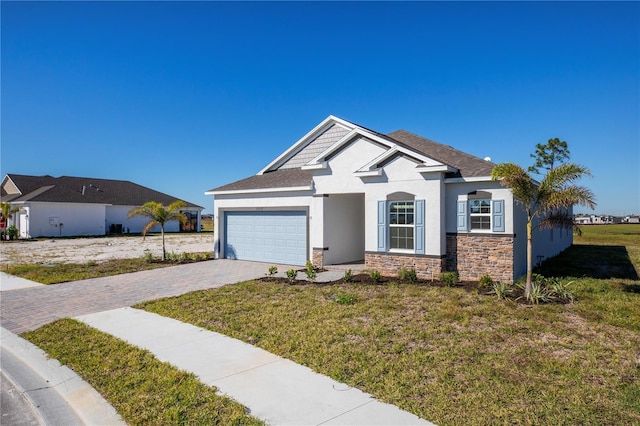 view of front of home featuring a garage and a front lawn