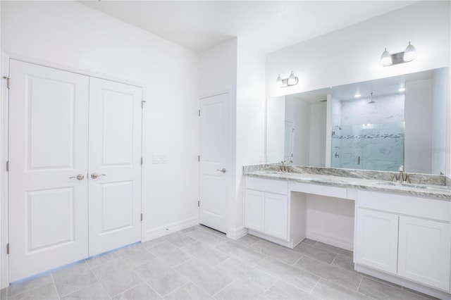 bathroom featuring vanity and an enclosed shower