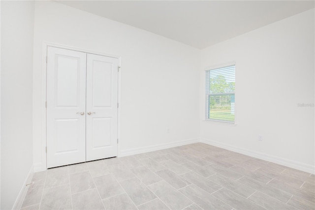 unfurnished bedroom with a closet