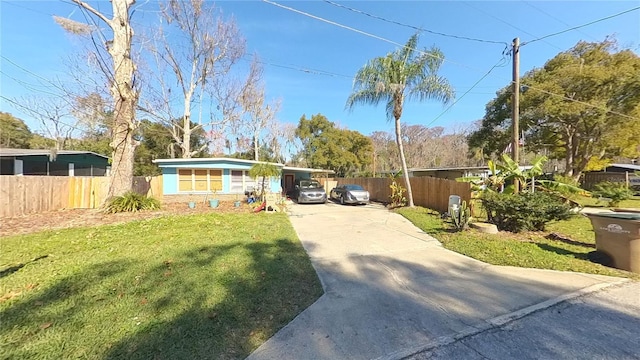 view of front facade featuring a front yard and a carport