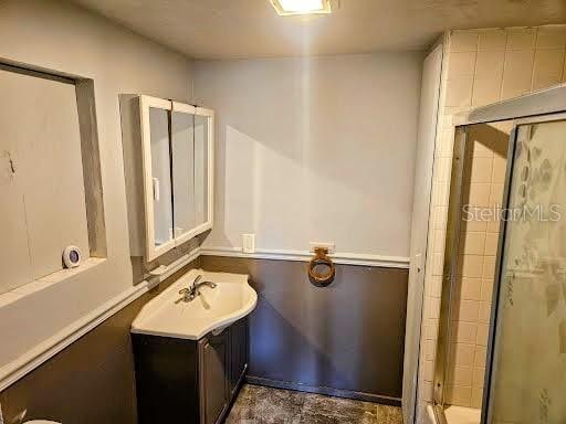 bathroom featuring vanity and walk in shower