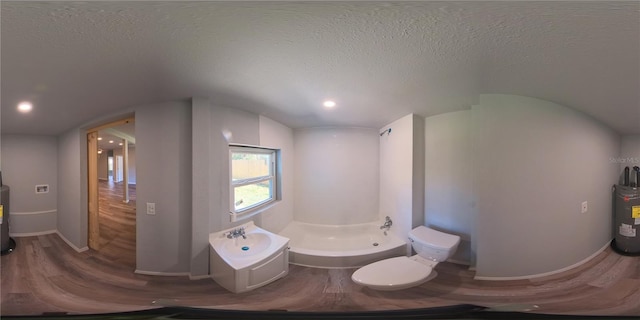 full bathroom with a textured ceiling, toilet, wood finished floors, baseboards, and a bidet