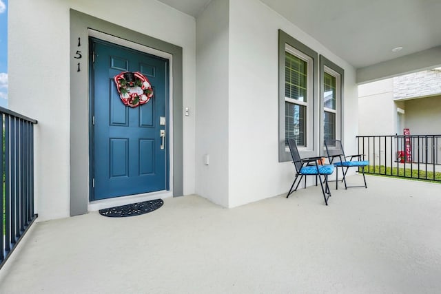 doorway to property featuring a porch