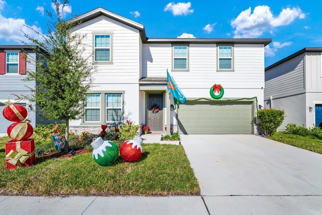 view of front of property with a front lawn and a garage