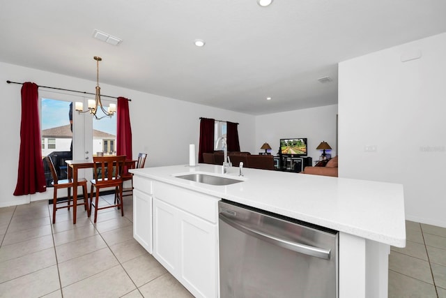 kitchen featuring sink, hanging light fixtures, an inviting chandelier, stainless steel dishwasher, and white cabinets