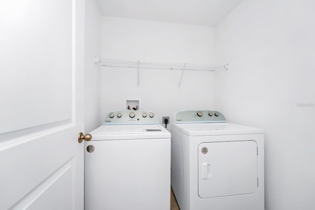 washroom featuring washing machine and dryer