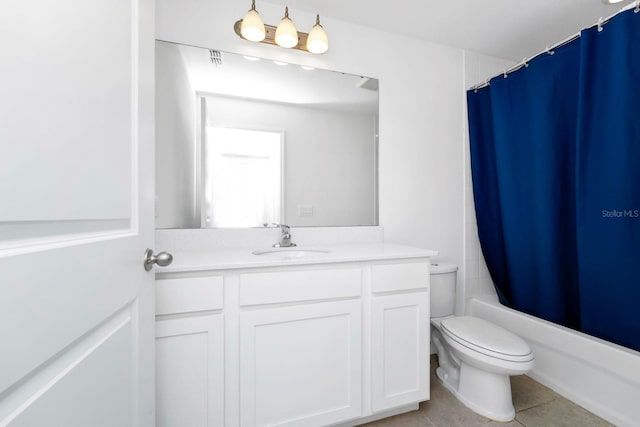 full bathroom featuring tile patterned flooring, vanity, toilet, and shower / bath combo