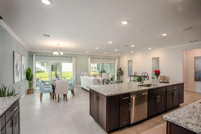 kitchen with dark brown cabinetry, sink, light stone counters, stainless steel dishwasher, and ornamental molding