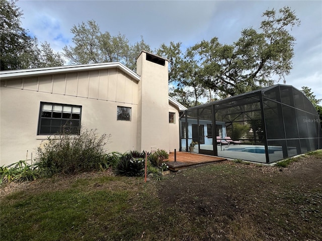 view of property exterior with a lanai