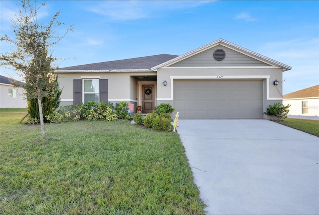 single story home with a front yard and a garage