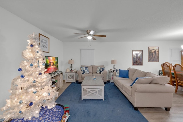 living room with ceiling fan and wood-type flooring