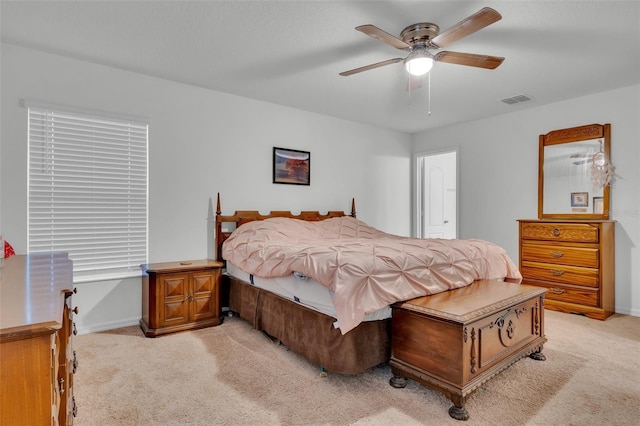 bedroom with light carpet and ceiling fan