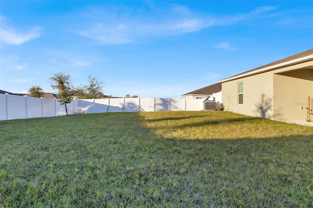 view of yard with central AC