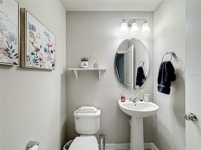 bathroom with sink and toilet