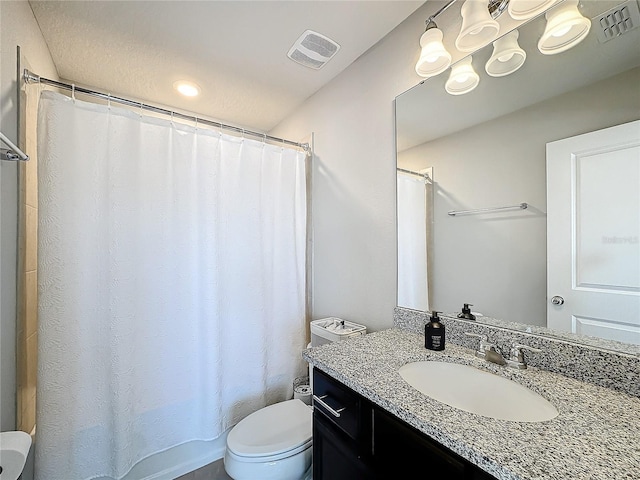 bathroom with a shower with curtain, vanity, and toilet