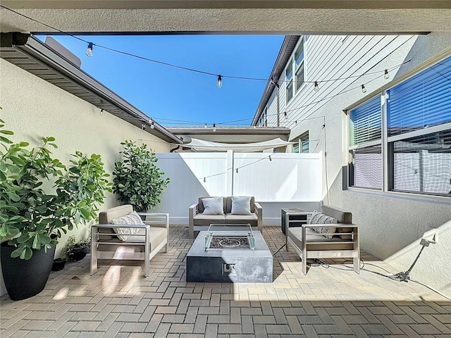 view of patio / terrace featuring an outdoor living space with a fire pit