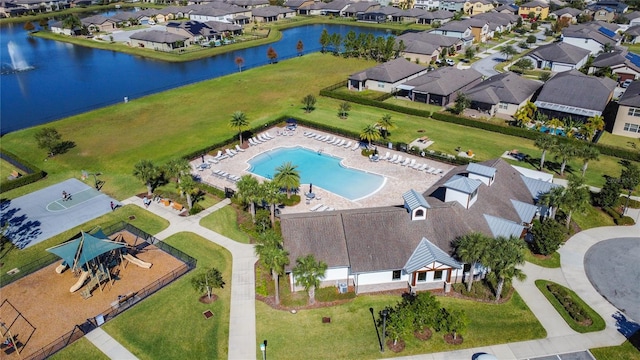 birds eye view of property with a water view