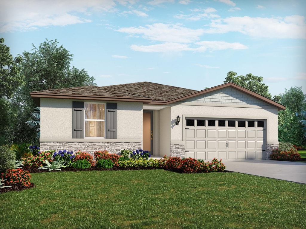 ranch-style house featuring a front yard and a garage