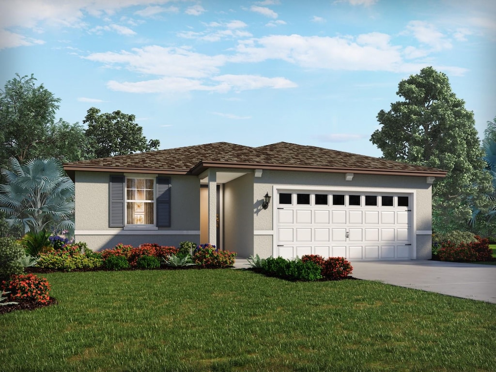 view of front of property with a front yard and a garage