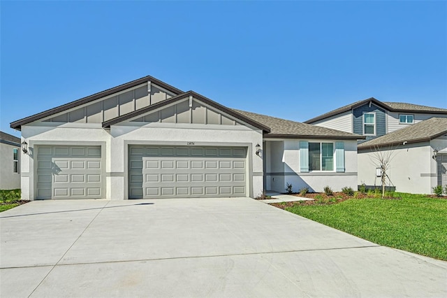 view of front of home featuring a garage and a front lawn