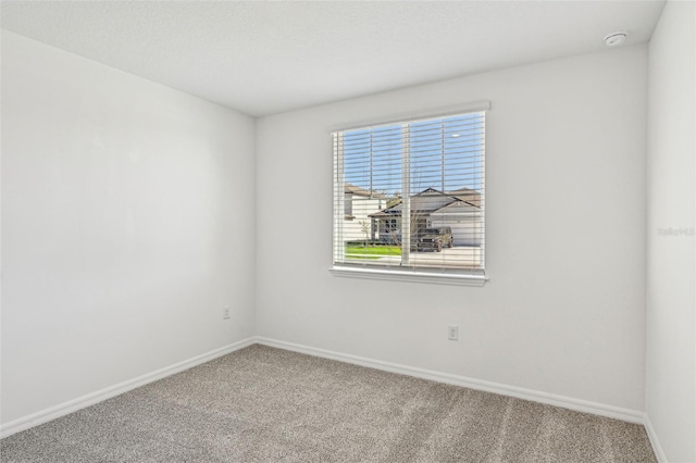 empty room featuring carpet flooring