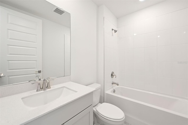 full bathroom featuring toilet, vanity, and tiled shower / bath combo