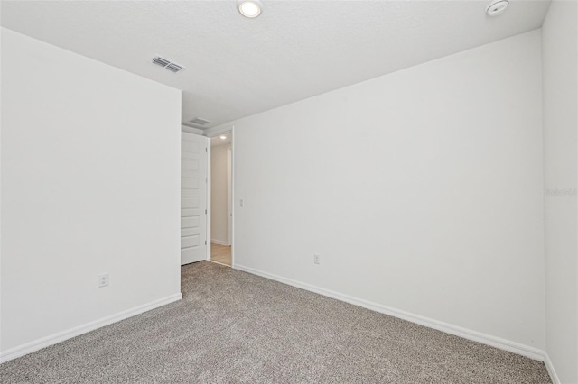 unfurnished room with carpet floors