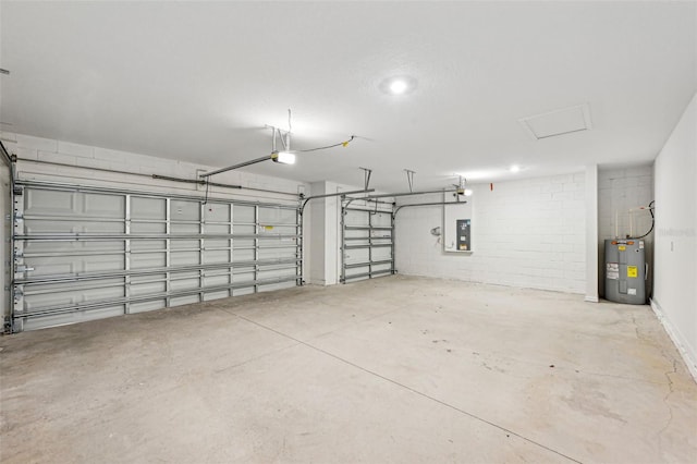 garage with a garage door opener, electric panel, and electric water heater