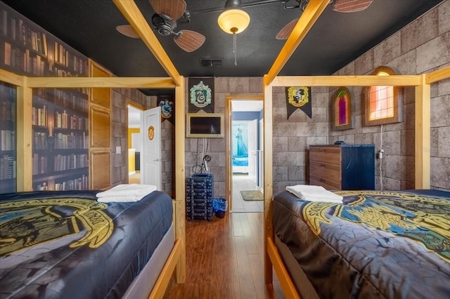 bedroom featuring hardwood / wood-style floors and ceiling fan