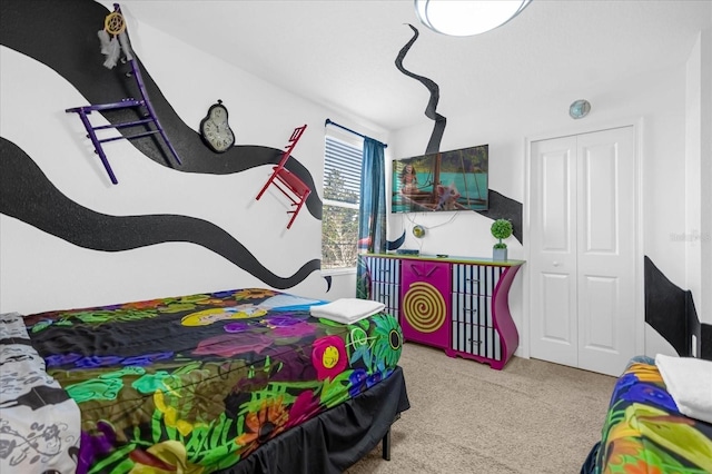 bedroom with carpet flooring and a closet