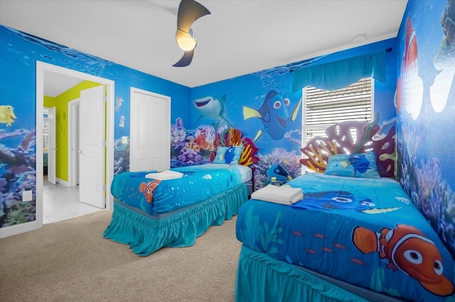 bedroom featuring ceiling fan and light carpet