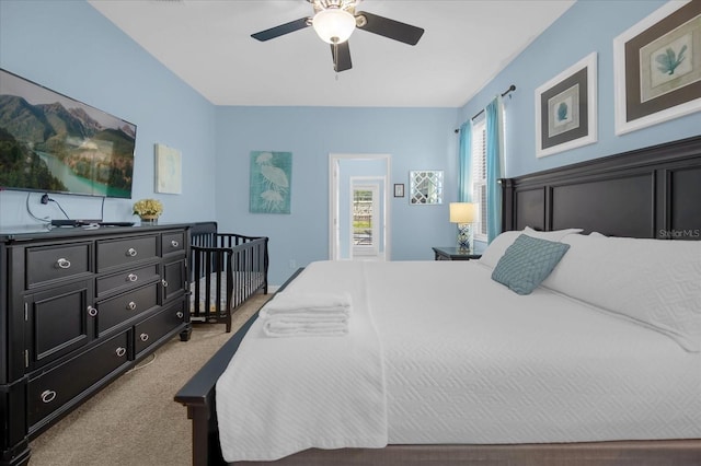 carpeted bedroom featuring ceiling fan